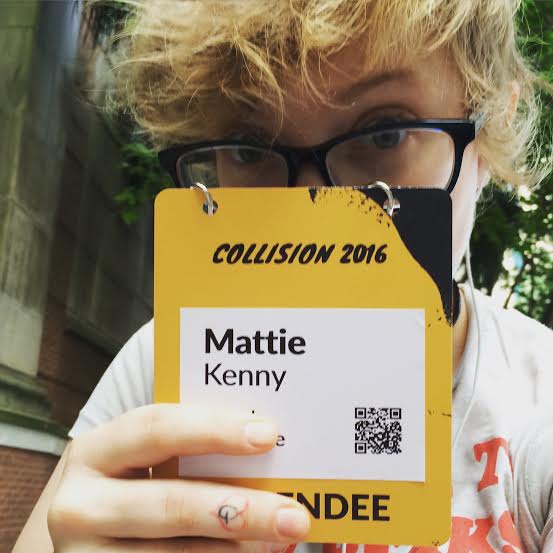 Mattie Kenny Holding Collision Conf Badge